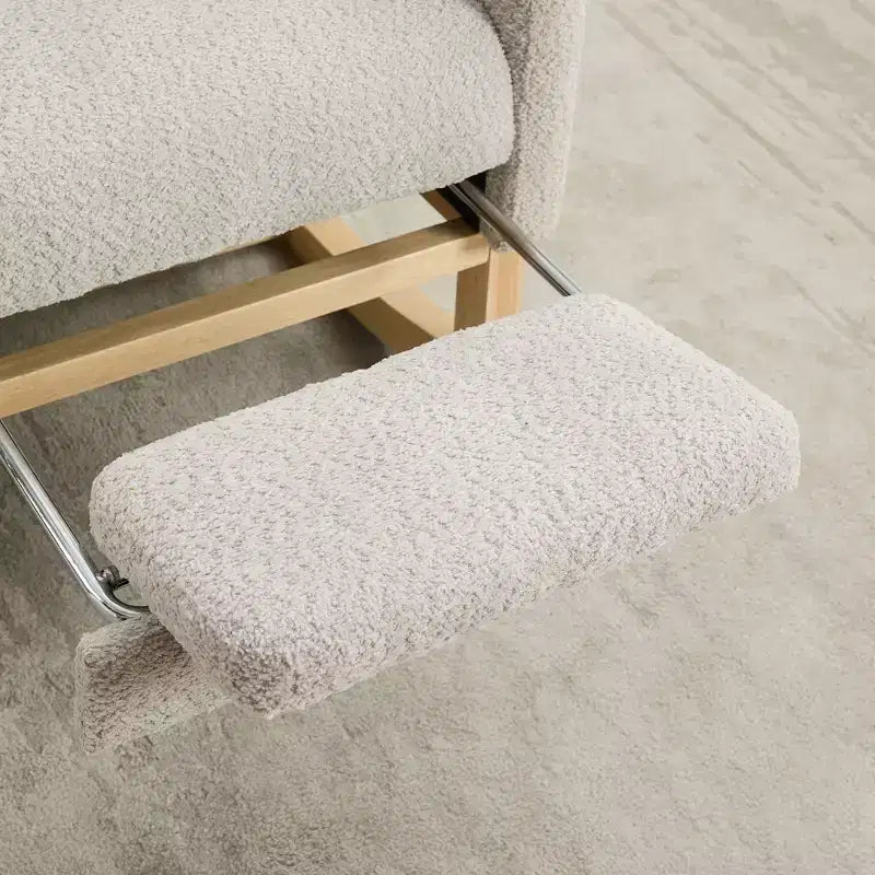 Fauteuil à bascule avec dossier haut, poche latérale et repose-pieds rétractable