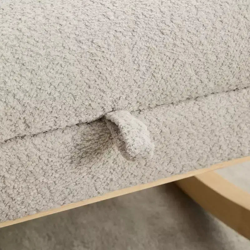 Fauteuil à bascule avec dossier haut, poche latérale et repose-pieds rétractable