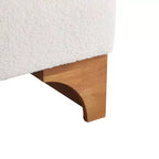Fauteuil Boucle avec dossier roulé et base en bois massif