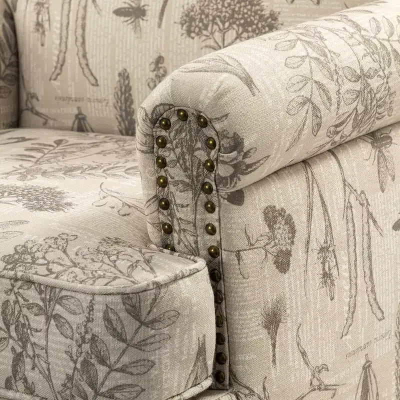 Fauteuil floral rembourré de style transitionnel avec dossier chameau et pieds en bois