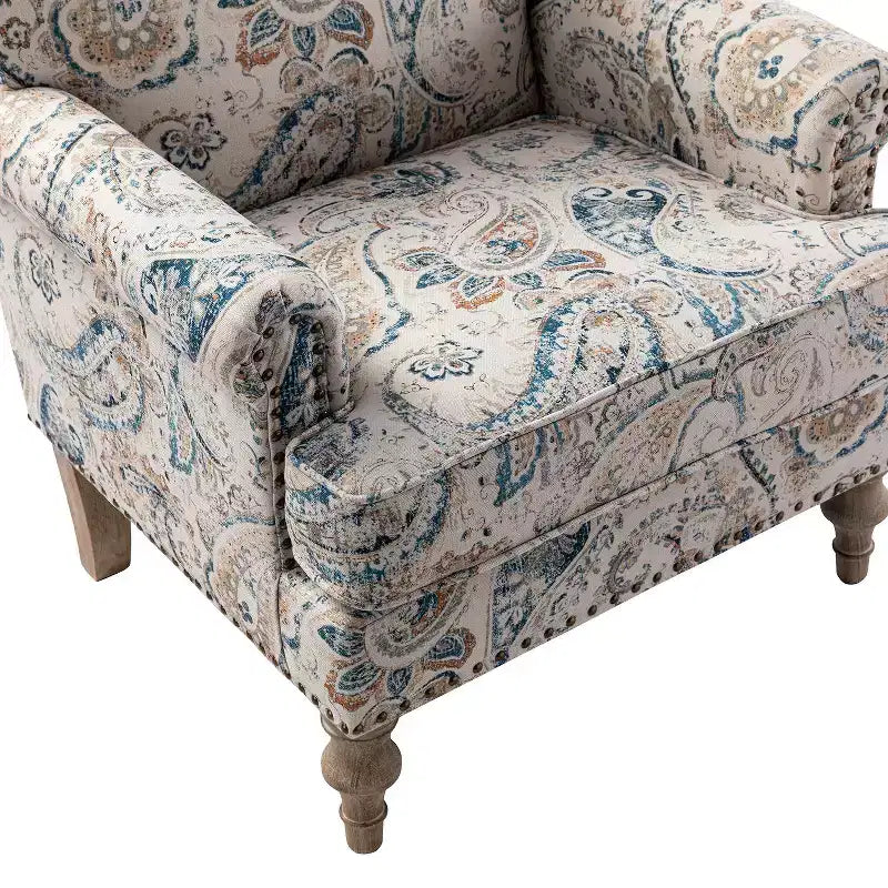 Fauteuil floral rembourré de style transitionnel avec dossier chameau et pieds en bois